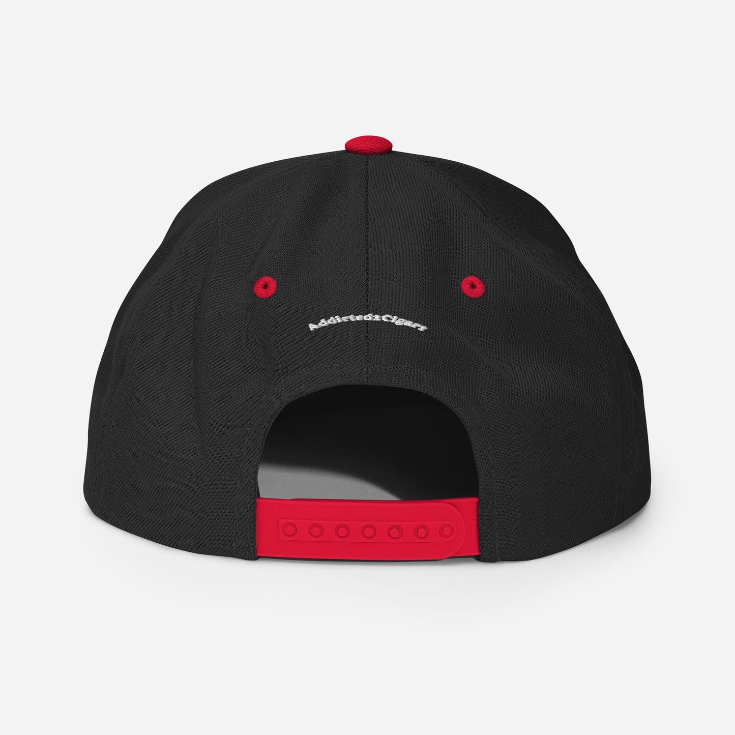 A black Addicted2Cigars Embroidered Snapback Hat displayed from the back, featuring a red adjustable strap and red button on top. Small white text is visible above the adjustable snap closure. The background is white.