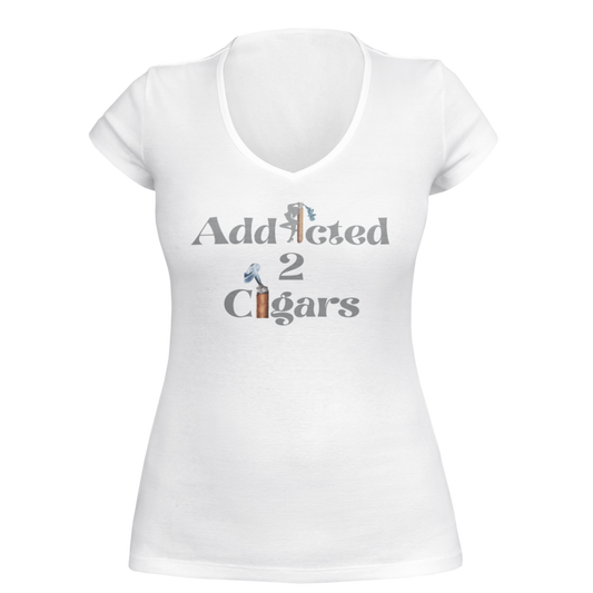 A gray women's V-neck T-shirt named "Addicted2Cigars Women Gray Short Sleeve" featuring the text "Addicted 2 Cigars" written across the front. The word "Addicted" has a cigar forming the letter "i," and a lit cigar creating the number "2," accompanied by smoke illustrations, perfect for those who appreciate a good cigar.