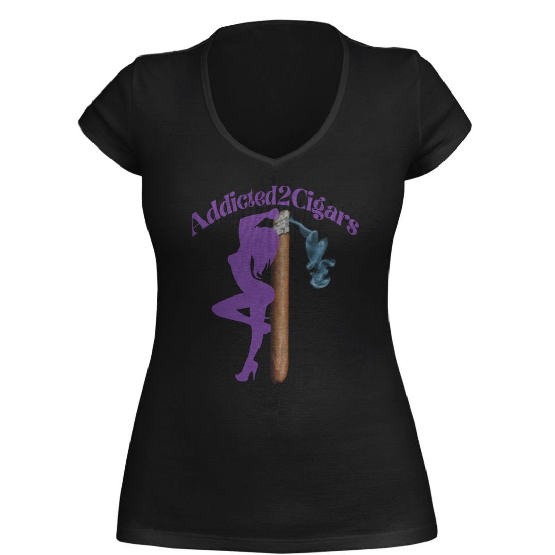 White/Purple short-sleeve T-shirt featuring a stylish silhouette of a woman in purple, posing next to a large cigar with smoke trailing from its lit end. Above the design, the text reads "Addicted2Cigars" in purple.