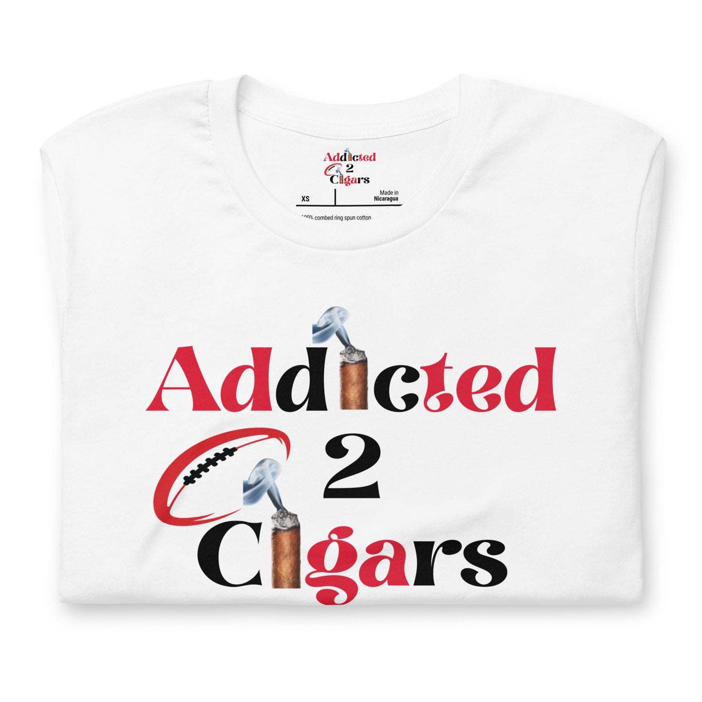 A white Unisex Addicted2Cigars Tampa Bay Football Short Sleeve T-shirt featuring the text "Addicted 2 Cigars" printed in red and black. The letter "I" in "Addicted" and the "2" are designed to resemble fine cigars, while the "O" in "Addicted" is shaped like a football.